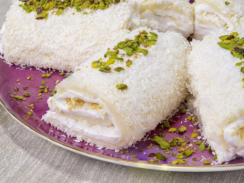 شیرینی رول نارگیل | آموزش تخصصی رول نارگیلی قنادی، فرمولاسیون حرفه‌ای، تکنیک تولید و رازهای بافت نرم